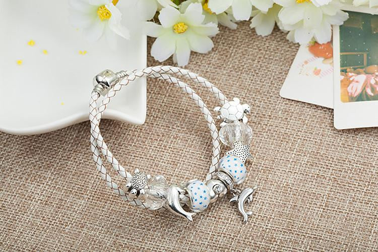 DOLPHINS CHARM BRACELET WHITE LEATHER "2" - WikiWii