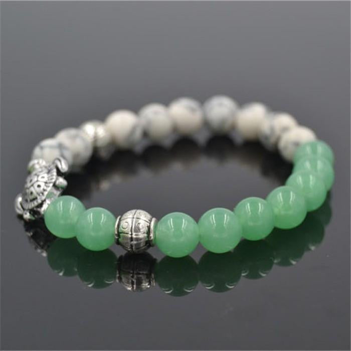 sea turtle charm 8 mm white and green bead bracelet - WikiWii