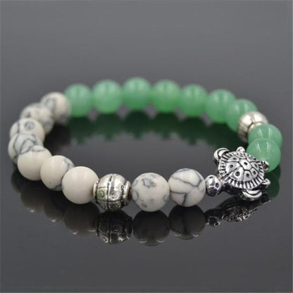 sea turtle charm 8 mm white and green bead bracelet - WikiWii